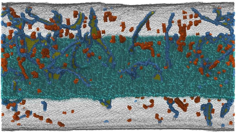 Snapshot from an MD simulation shows dislocation interactions with a high-angle grain boundary and the formation of dislocation debris in Al