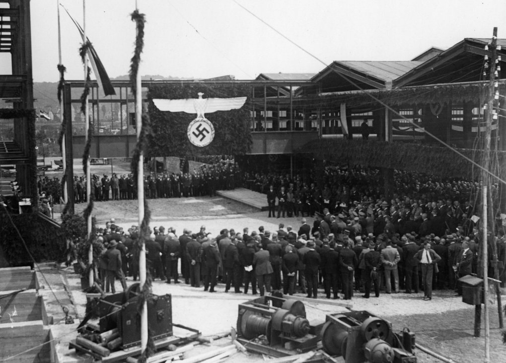 Group of people standing in front of a building.