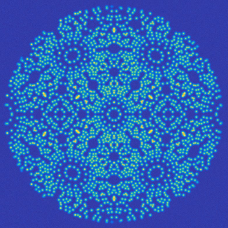 Convex-hull based simulation of a field ion micrograph obtained for a 20nm-radius body centred cubic needle-shaped specimen. Colour scheme indicates various intensities of imaged atoms. Such images are being used to train a machine-learning algorithm to automatically extract atomic positions at the specimen’s surface and help reconstruct true atomically-resolved tomograms from FIM.