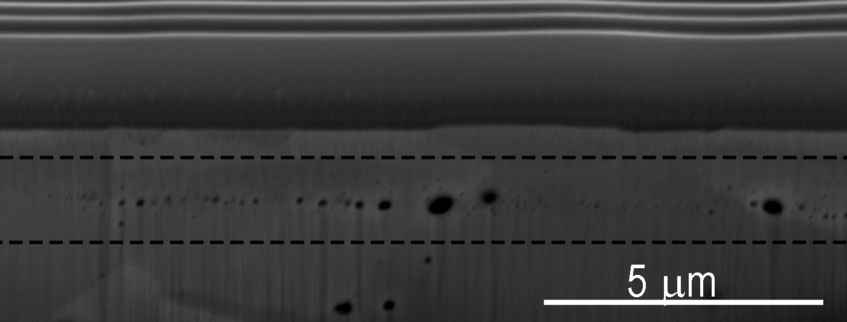 Figure 1: Cross-section SEM micrograph of W-W2C composite irradiated with 1 MeV He+ ions after high temperature annealing. Figure 1: Cross-section SEM micrograph of W-W2C composite irradiated with 1 MeV He+ ions after high temperature annealing.