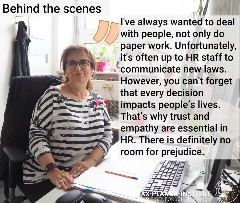 Woman in striped shirt at office desk with HR quote.