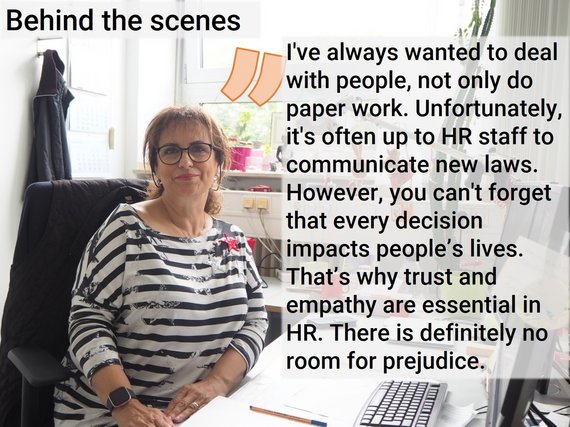 Woman in striped shirt at office desk with HR quote.