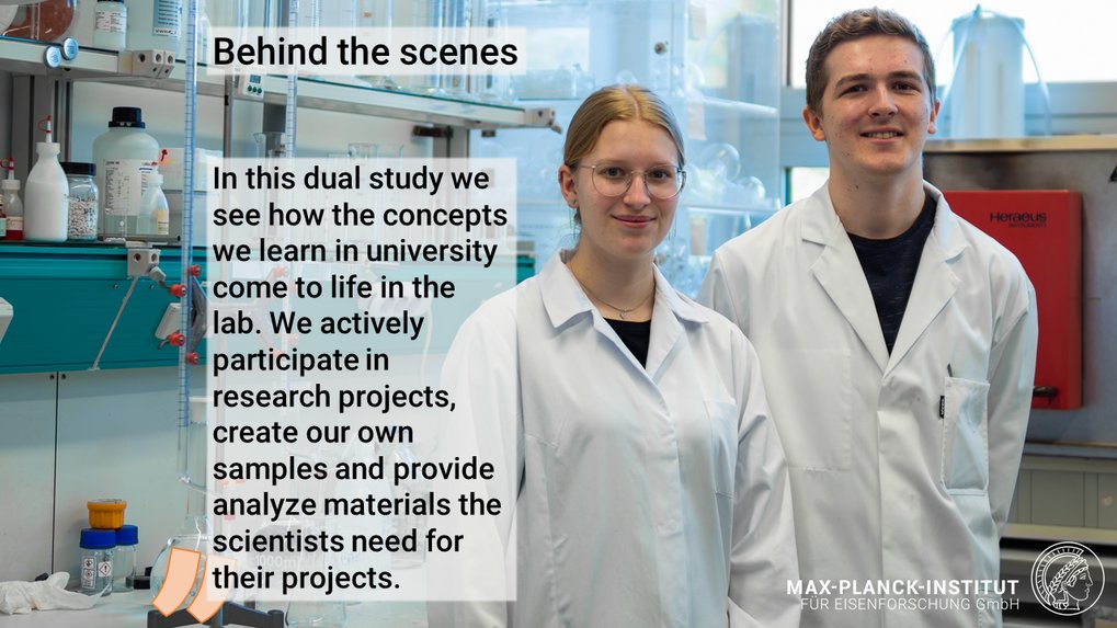 Two individuals in lab coats standing in a laboratory setting.