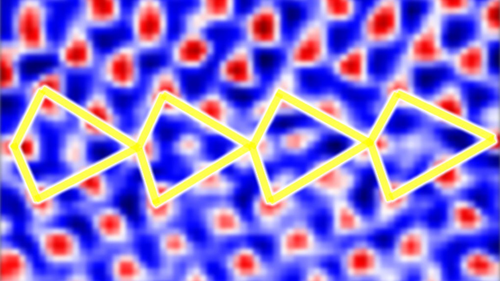 A yellow zigzag line overlays a blue background with red patterns resembling abstract shapes.