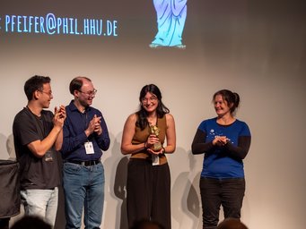 Genna Monahan, postdoctoral researcher at the Max Planck Institute for Sustainable Materials, has won the Science Slam of the 5. Night of Science in Düsseldorf. Genna Monahan, postdoctoral researcher at the Max Planck Institute for Sustainable Materials, has won the Science Slam of the 5. Night of Science in Düsseldorf.