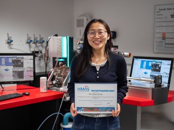 Hydrogen embrittlement is one of the main challenges to new, more efficient alloys. Xizhen Dong investigates how to mitigate its devastating effects Woman holding certificate, stands in microscope laboratory.