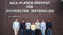Members of the group outside in front of the institute