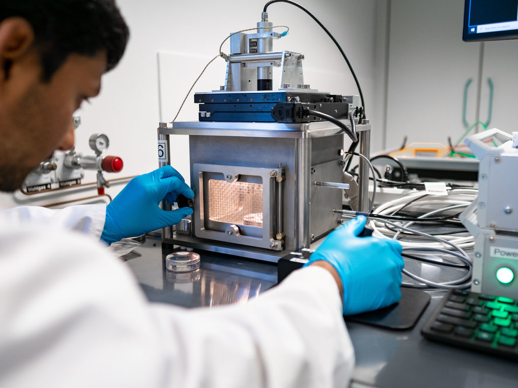 Person looking into a scientific device
