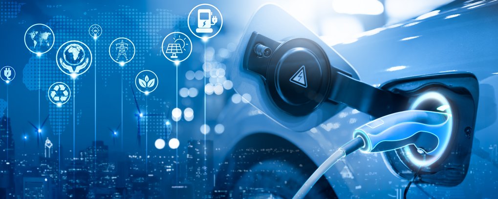 Electric car being charged. The background shows icons for wind turbines, sustainability, recycling etc. 