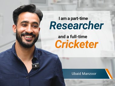 Smiling man, text stating part-time researcher and full-time cricketer.